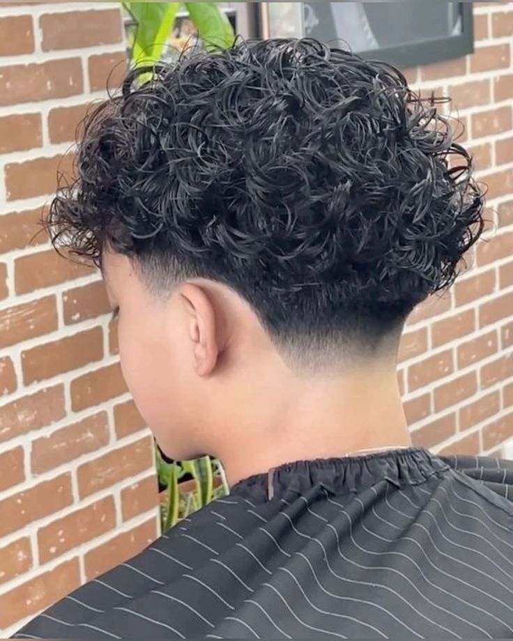 a curly low temper fade