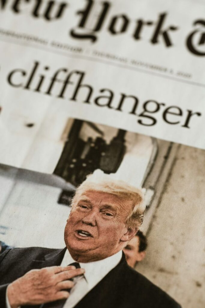 a picture of trump tariffs and a headline saying "cliffhanger"